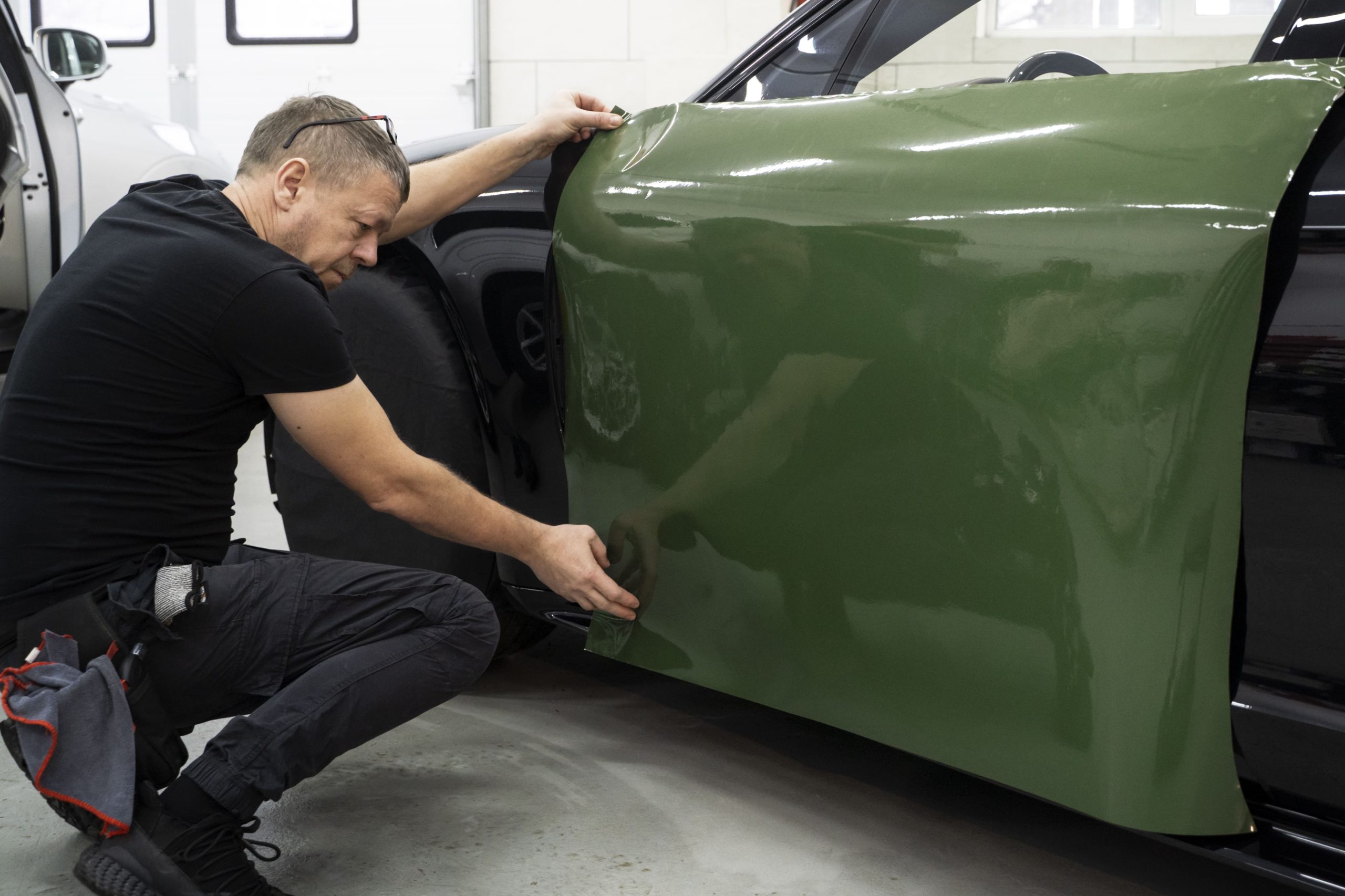 Technician Applying Custom Vehicle Wrap